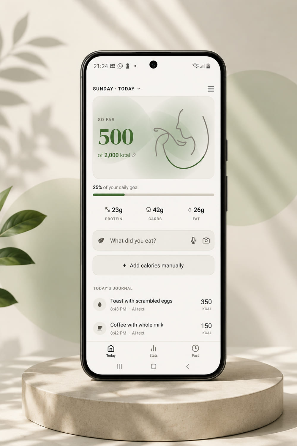 Kansaya daily screen, showing calories against a goal, macronutrients and a journal of logged meals.